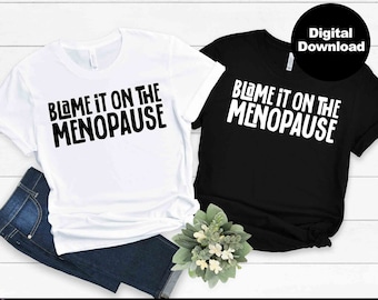 May include: Two t-shirts with the text "Blame it on the Menopause" in black lettering on a white t-shirt and a black t-shirt.