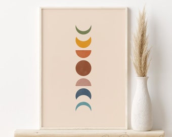 May include: A printable wall art print featuring a minimalist design of a series of colorful crescent moons in shades of green, yellow, orange, brown, pink, blue, and teal against a light peach background.