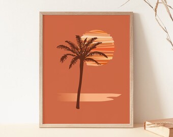 Könnte beinhalten: Ein gerahmter Druck einer Palmensilhouette mit einem Sonnenuntergang dahinter. Der Sonnenuntergang ist ein Kreis aus orangefarbenen, roten und gelben Streifen. Der Hintergrund ist einfarbig orange.