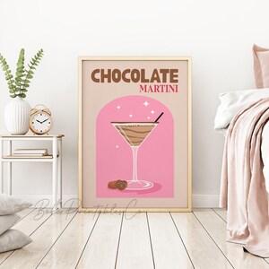 May include: A printable poster with a pink background and a gold frame. The poster features a martini glass filled with a chocolate drink and the text "CHOCOLATE MARTINI".