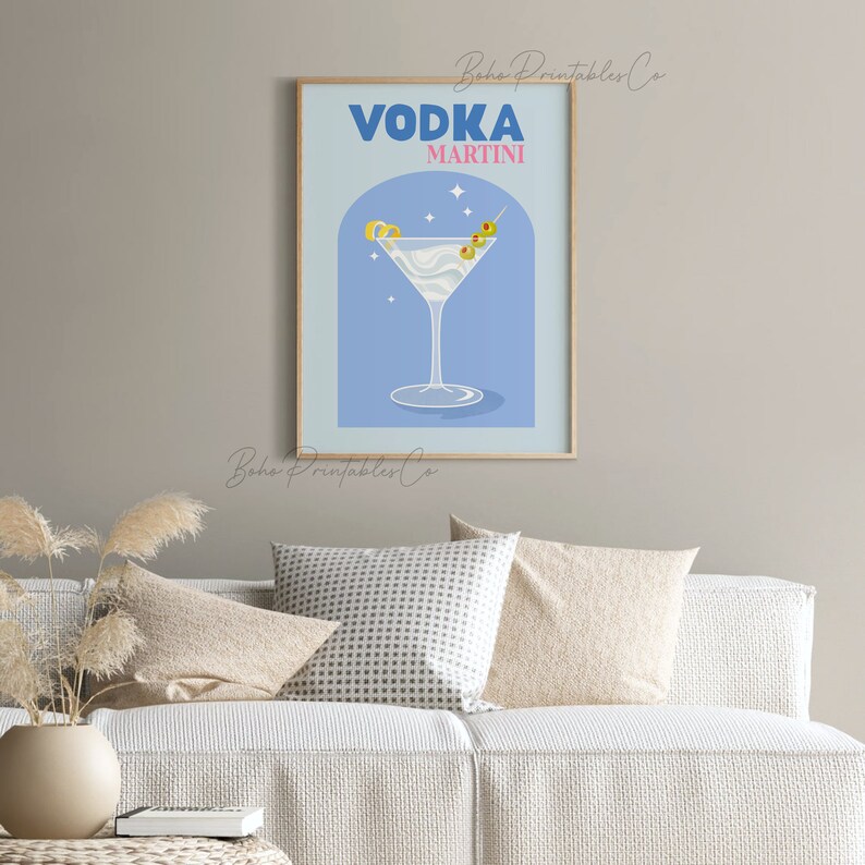 May include: A blue and white printable art print with the text "VODKA MARTINI" in bold blue letters. The print features a martini glass with a blue stem and a light blue background.