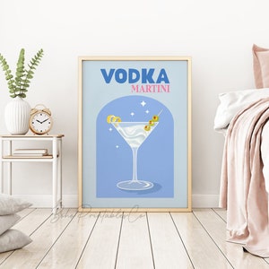 May include: A blue and gold poster with the text "VODKA MARTINI" in a retro font. The poster features a martini glass with a lemon twist and olives, set against a blue background with white stars.