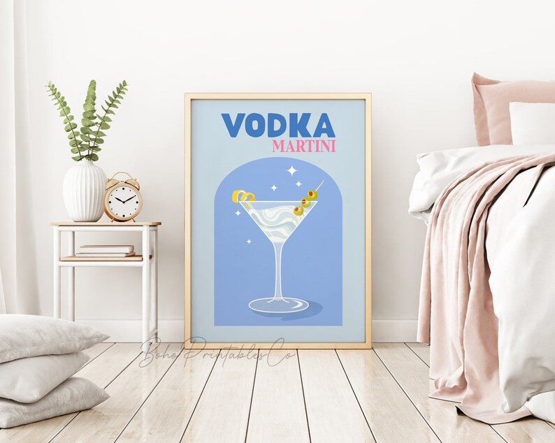 May include: A blue and gold poster with the text "VODKA MARTINI" in a retro font. The poster features a martini glass with a lemon twist and olives, set against a blue background with white stars.