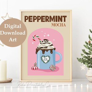 May include: A digital printable art print with a pink background and a blue mug with a peppermint mocha drink. The mug has a green wreath with the text "Merry Christmas" inside. The text "Peppermint Mocha" is at the top of the print.