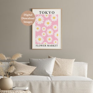 May include: A printable poster with a pink background and white daisies. The poster says "TOKYO FLOWER MARKET" in black text.
