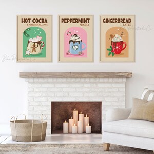 May include: Three printable posters with illustrations of winter drinks. The posters are in a brown frame and feature a hot chocolate with marshmallows, a peppermint mocha, and a gingerbread latte.