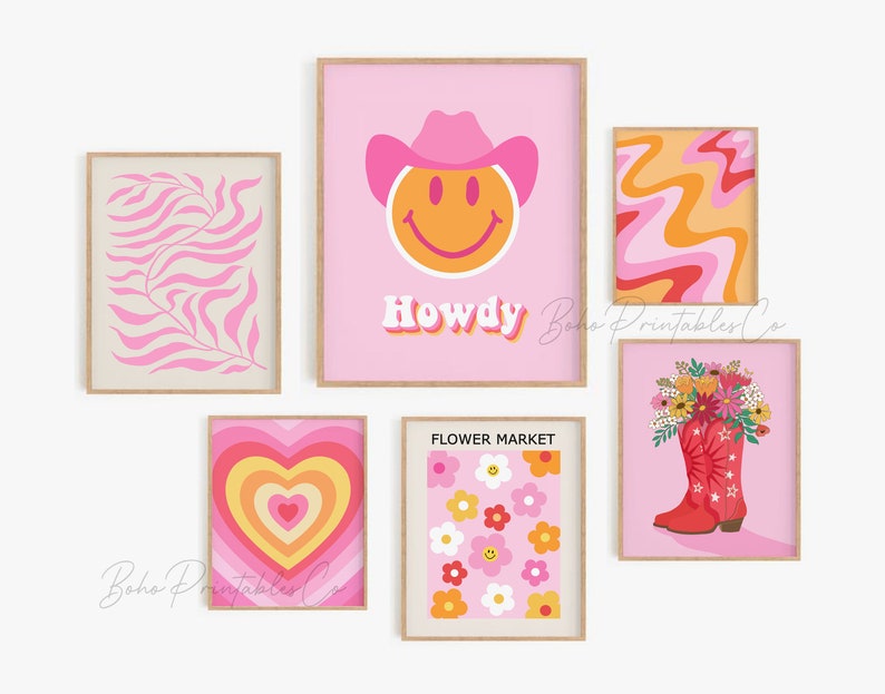 May include: A set of six pink and orange printable wall art prints featuring a smiley face wearing a cowboy hat, a heart with concentric circles, a floral bouquet in a red cowboy boot, a flower market design, a pink and orange swirl pattern, and a pink and white leaf pattern. The prints have the text "Howdy" and "Flower Market" on them.