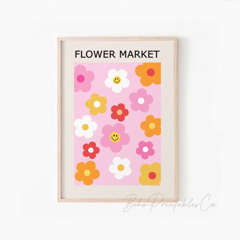 May include: A printable wall art design featuring a pink background with a repeating pattern of colorful flowers. The flowers are in shades of pink, red, yellow, and orange. The text "FLOWER MARKET" is at the top of the design.