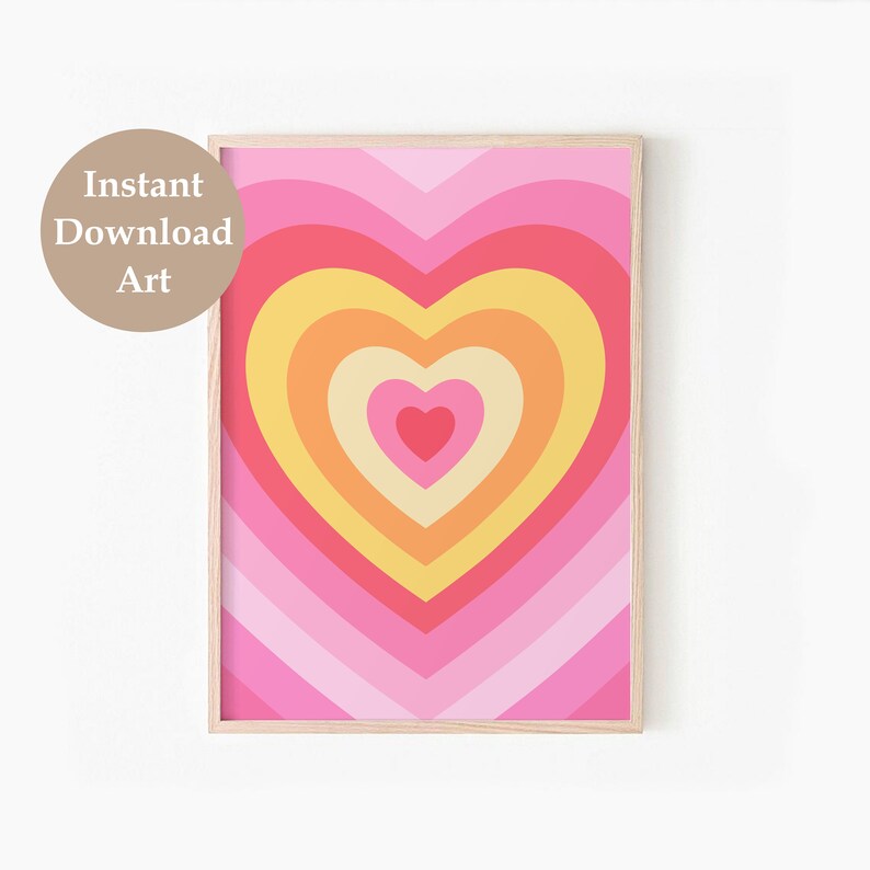 May include: A digital print of a pink, yellow, and orange heart with concentric circles. The heart is framed in a light wood frame.