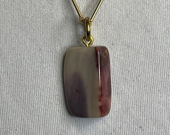 Beautifully polished Petrified Wood from the Mountains of California! Found in the magnificent Lake Tahoe area. On a unique Gold 21" Chain.