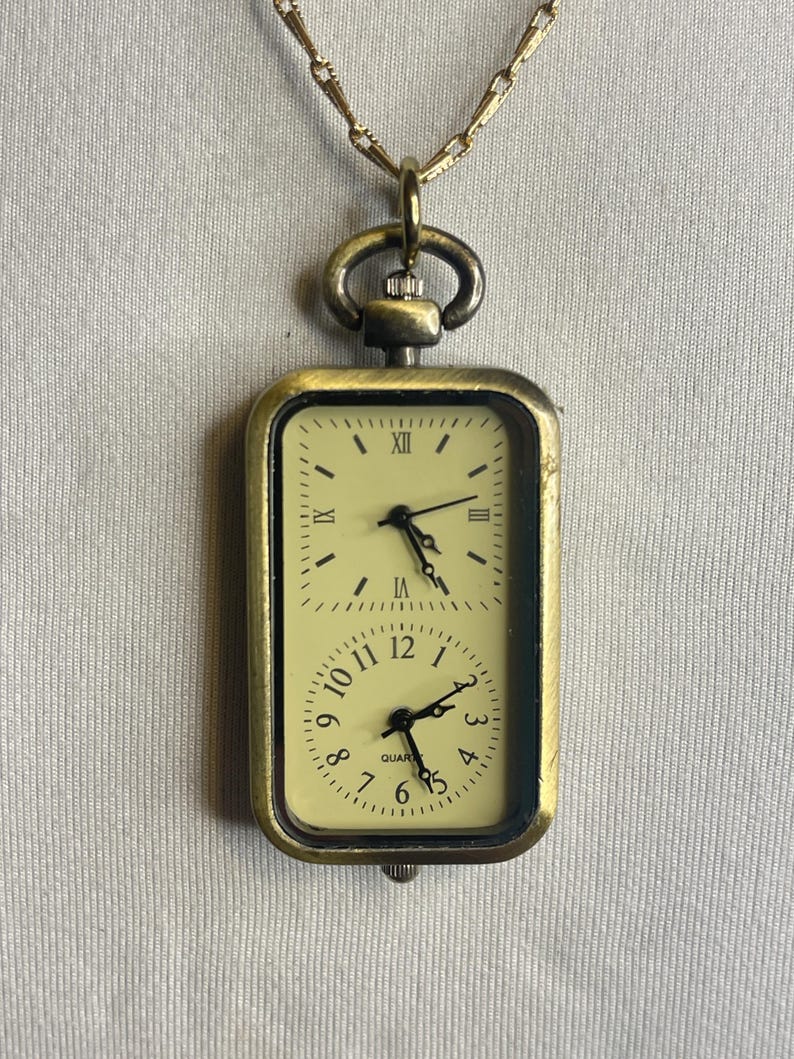 Antiqued Duel Clock Pendant With a 30 Bronze Chain. Great Little Gift