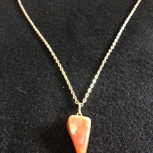 Gorgeous Yellow Jade Gemstone Found in Madagascar near the foothills and jungle Hand polished and set on an 18k gold snake 17” necklace.