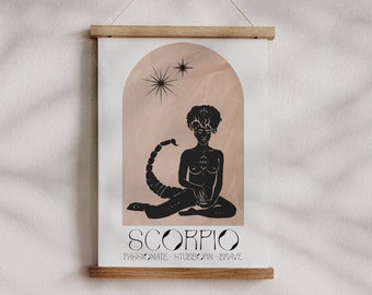 May include: A black and white illustration of the Scorpio zodiac sign. The illustration features a woman with a scorpion tail sitting in a meditative pose. The background is a peach color with a white arch. The text "Scorpio" is written in black below the illustration, with the words "Passionate - Stubborn - Brave" written in smaller font below the word "Scorpio".