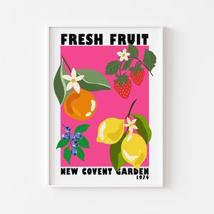 May include: A pink poster with the text "FRESH FRUIT NEW COVENT GARDEN 1974" in black. The poster features illustrations of a lemon, orange, blueberries, strawberries, and flowers.