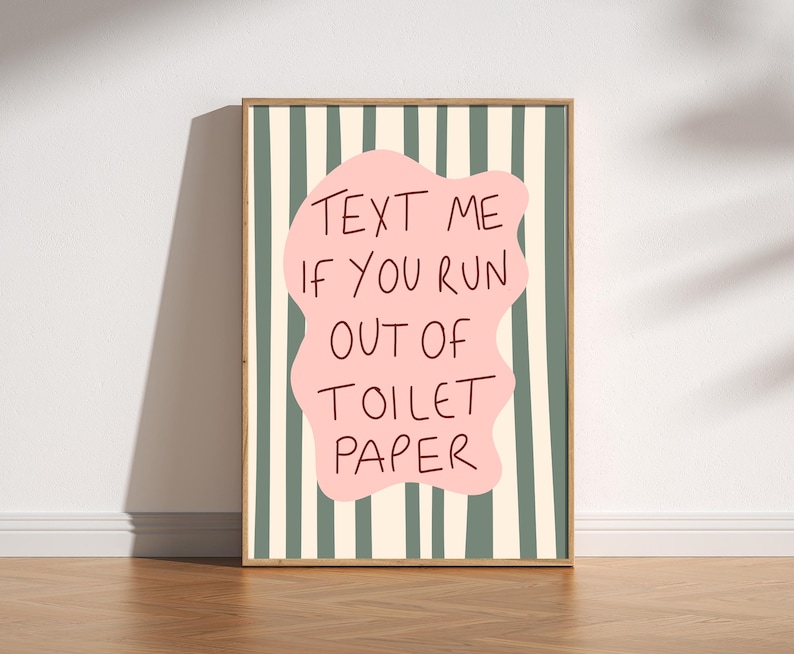 Funny bathroom wall art print with pink blob and wavy green stripes that reads “Text Me If You Run Out Of Toilet Paper”.