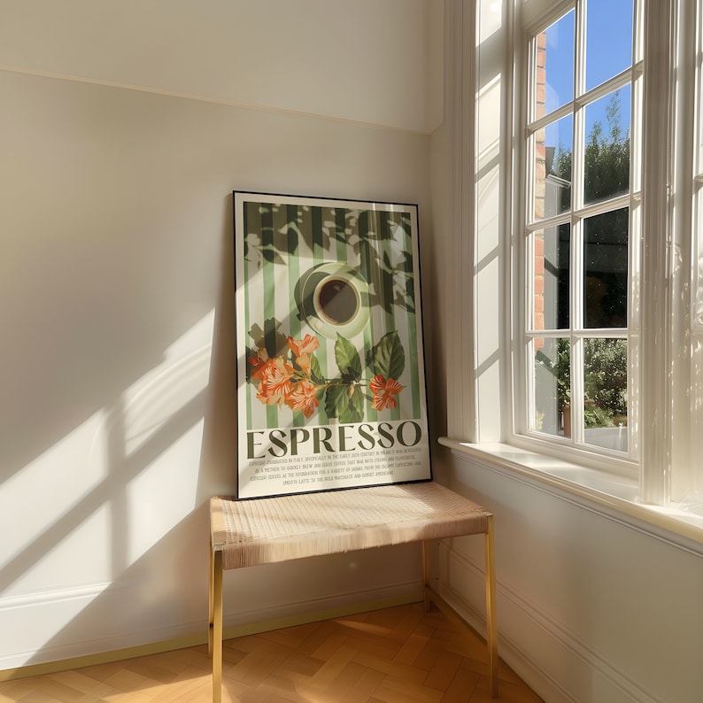 May include: A framed art print featuring the word "ESPRESSO" in a bold font, with a coffee cup illustration and floral accents. The print has a green and white striped background. The print is displayed on a woven bench with gold legs.
