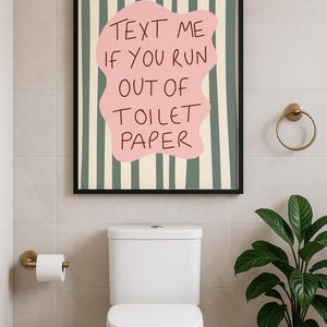 Funny bathroom wall art print with pink blob and wavy green stripes that reads “Text Me If You Run Out Of Toilet Paper”.