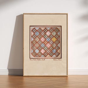 May include: A framed print featuring a Nine Patch Pattern Quilt by Rebecca Davis. The artwork displays a square quilt with a grid of small, multi-colored checkered squares arranged in a diamond orientation, set against a light beige background.