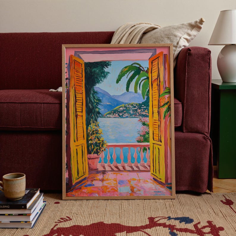 A Fauvist style painting inspired by Matisse, featuring a open patio doors overlooking a vibrant Italian landscape and Lake Como. The scene bursts with beautiful blue and pink tones: trees, mountains in the distance and the shimmering blue of the lake under a clear blue sky. The view captures the idyllic charm of summer by the water, with pots of flowers on the terrace and palm trees.