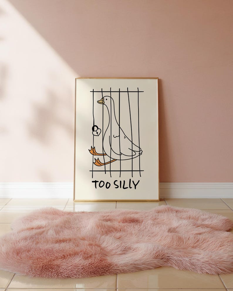 Bring a smile to your space with this Too Silly goose art print! A funny, minimalist illustration featuring a cheeky goose behind bars for being “too silly.” Perfect for adding personality to your home, office, or gallery wall.
This quirky silly goose animal print makes a wonderful gift for friends who love humor, cottagecore whimsy, or modern minimalist art. Designed to brighten up any corner and spark joy daily.