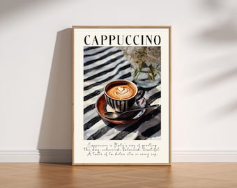 May include: A framed print featuring a cappuccino. The image shows a cup of coffee with latte art on a saucer with a spoon, set against a black and white striped background. The word "CAPPUCCINO" is at the top, with text below.