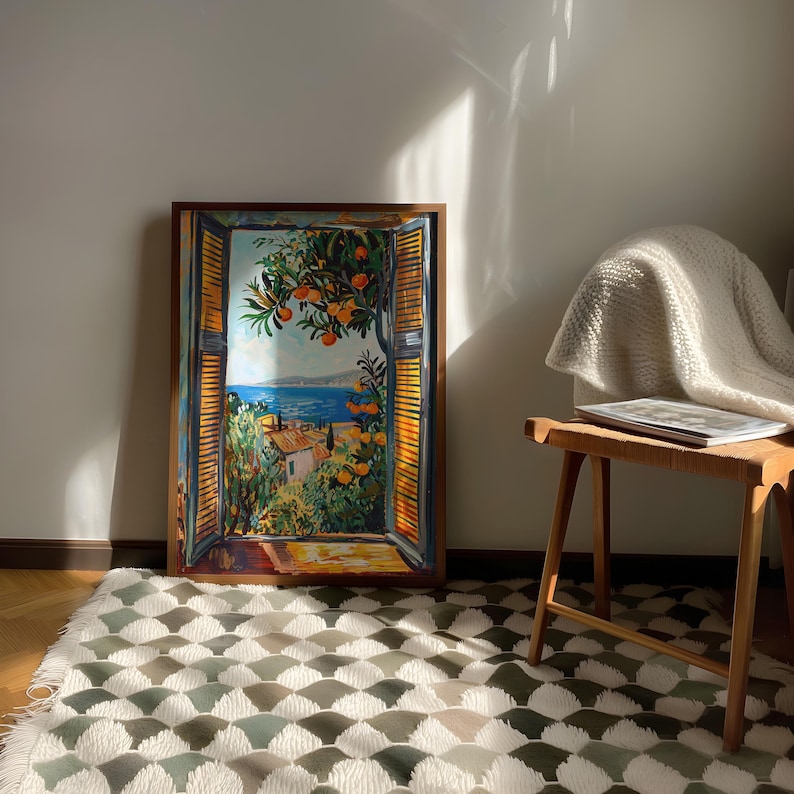 Add Mediterranean charm to your home with this vibrant Fauvism-style painting inspired by Henri Matisse. It features an open window overlooking the ocean, with a picturesque coastal view, including a little coastal village. Lush orange trees, the sea