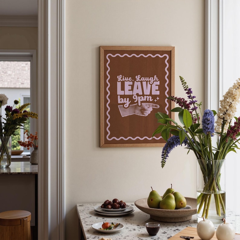 Make your guests laugh (before they leave at 9!)
Live laugh leave by 9pm, a funny, playful twist on the phrase we all love to hate.
A great hallway/entryway poster, or housewarming gift!