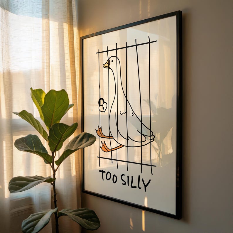 Bring a smile to your space with this Too Silly goose art print! A funny, minimalist illustration featuring a cheeky goose behind bars for being “too silly.” Perfect for adding personality to your home, office, or gallery wall.
This quirky silly goose animal print makes a wonderful gift for friends who love humor, cottagecore whimsy, or modern minimalist art. Designed to brighten up any corner and spark joy daily.