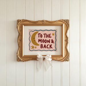 Hand-drawn children’s illustration featuring the phrase “To the Moon & Back” in bold, brush-style lettering with a soft, painterly texture. A smiling crescent moon with simple closed eyes appears beside the text, accompanied by small star shapes that add a gentle, playful feel. A wavy hand-drawn border frames the artwork, giving it a cosy, retro look. The overall style is warm, friendly and nostalgic, with an imperfect hand-painted aesthetic designed to feel comforting and child-friendly.
