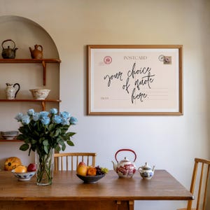 Choose whatever quote or phrase you'd like to be displayed on the art, a personalised postcard print. Designed in a vintage postcard style with elegant handwritten typography, this piece makes a beautiful addition to cozy living rooms, entryways, bedrooms, or gallery walls. Bring a touch of warmth and comfort into your space with this personalised custom quote print. Choose whatever quote or phrase you'd like to be displayed on the art.