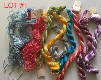 May include: Lot #1 of embroidery floss in a variety of colors, including blue, red, green, yellow, gray, turquoise, and purple. The floss is wound into skeins and labeled with the brand name and color number.