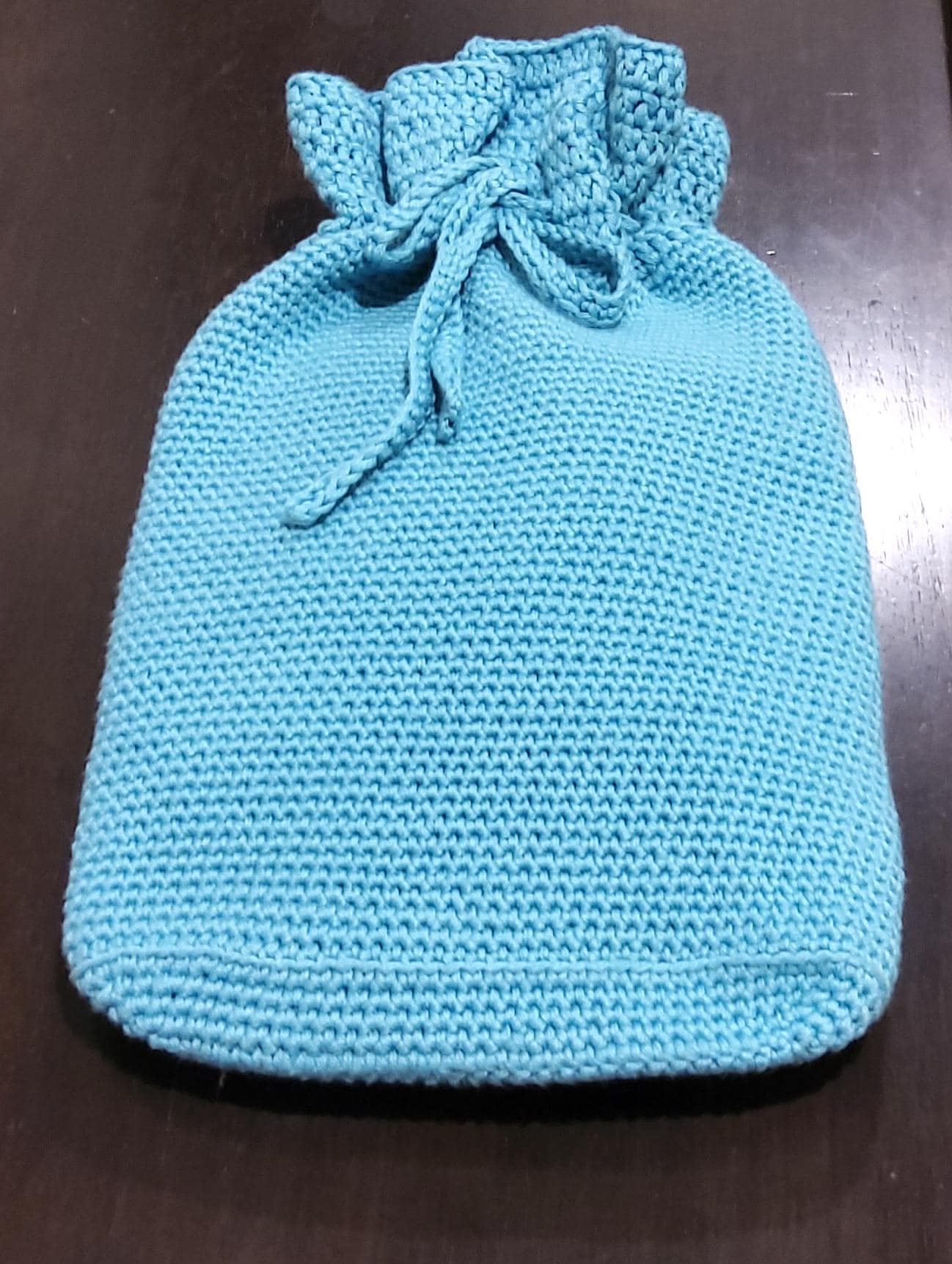 Crocheted adult sized hot water bottle cover