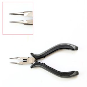 May include: Black handled pliers with silver tips. The pliers are labeled "Bead Smith".