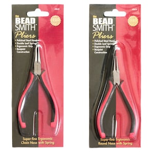 May include: Two pairs of pliers on red and black packaging. The pliers are labeled "The Bead Smith Pliers". One pair is labeled "Super-fine Ergonomic Chain Nose with Spring" and the other is labeled "Super-fine Ergonomic Round Nose with Spring".