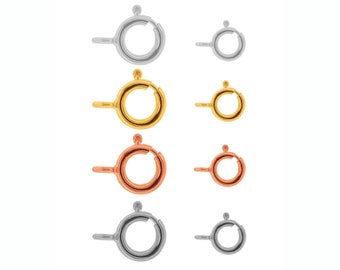 May include: Set of six jump rings in three different metal finishes: silver, gold, and rose gold. Each ring has a small ball on top.