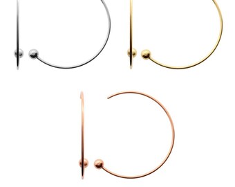 May include: Three pairs of hoop earrings with a small ball at the end. The hoops are available in silver, gold, and rose gold.