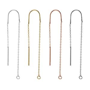May include: Four pairs of earrings with a simple, minimalist design. Each earring features a curved bar with a dangling chain and a small, straight bar at the bottom. The earrings are available in silver, gold, rose gold, and black.