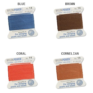 May include: Four spools of nylon power string for stringing pearls and beads. The colors are blue, brown, coral, and carnelian. Each spool is labeled with the brand name, "Nylon Power", the size, "No. 14", and the thickness, "0 1,02 mm".