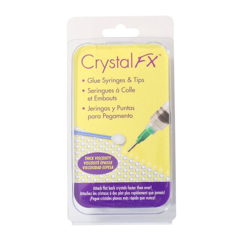May include: Crystal FX glue syringes and tips package. The package includes a syringe with a green tip and a white applicator. The text on the package says "Attach flat back crystals faster than ever!"