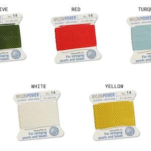May include: Five spools of nylon thread for stringing pearls and beads. The spools are labeled with the colors: Olive, Red, Turquoise, White, and Yellow. Each spool is labeled "Nylon Power" and has the size "No. 14" and the thickness "0 1,02 mm".