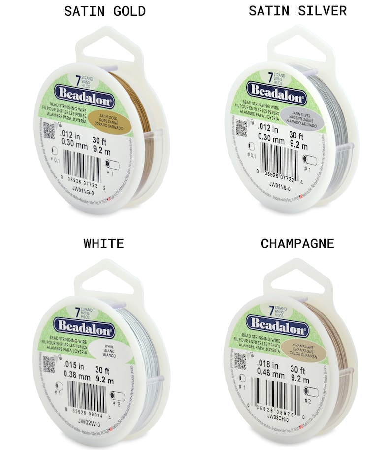 May include: Four spools of Beadalon bead stringing wire in satin gold, satin silver, white, and champagne. Each spool is labeled with the wire thickness in inches and millimeters, and the length in feet and meters.