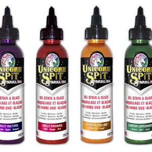 May include: Six bottles of Unicorn Spit Sparkling Gel Stain & Glaze in various colors, including sapphire blue, violet vulture, dolly firebird, golden gosling, lavish lovebirds, and starling sasha.