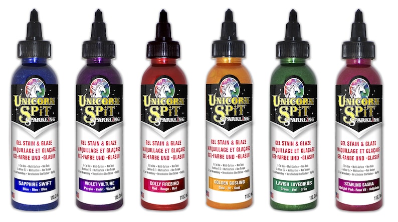 May include: Six bottles of Unicorn Spit Sparkling Gel Stain & Glaze in various colors, including sapphire blue, violet vulture, dolly firebird, golden gosling, lavish lovebirds, and starling sasha.