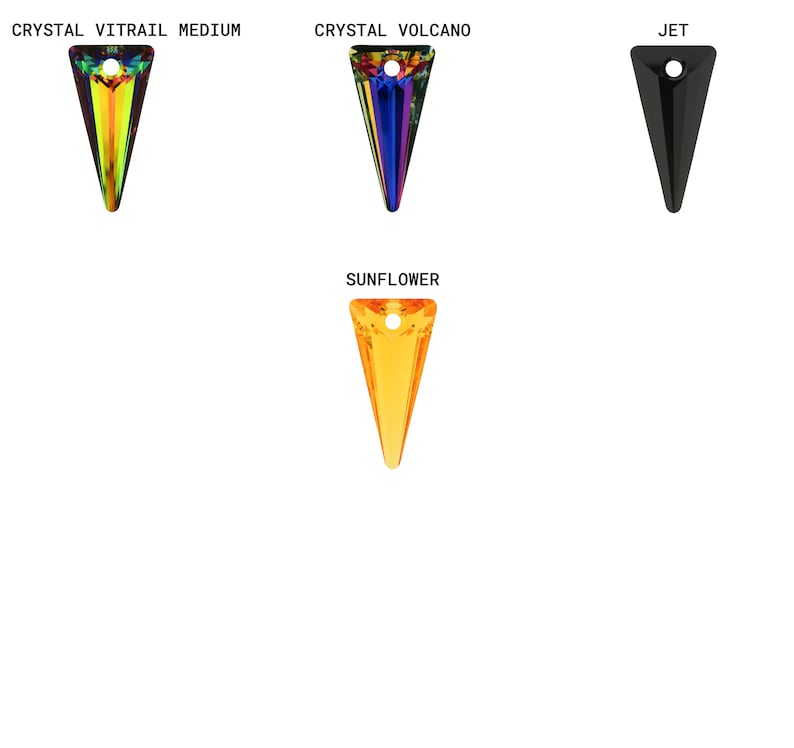 May include: Four different colored crystal pendants in the shape of a triangle. The colors are rainbow, blue, black, and orange.