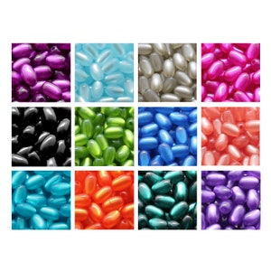 以下が含まれることがあります： 黒、青、緑、オレンジ、ピンク、紫、赤、白など、さまざまな色の楕円形のビーズの詰め合わせです。