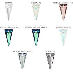 May include: Assortment of crystal pendants in various colors, including clear, iridescent, blue, and pink. The pendants are shaped like a pointed triangle.