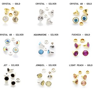 May include: Assortment of 10 different colors of round rhinestones with gold or silver settings. The colors include crystal, crystal AB, aquamarine, fuchsia, jet, jonquil, and light peach.