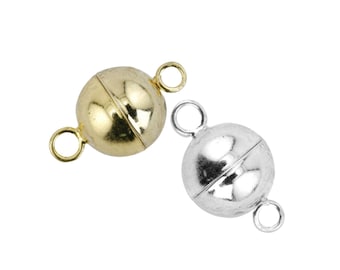 Könnte beinhalten: Zwei magnetische Verschlüsse zum Schmuck basteln. Einer ist golden und der andere silbern.