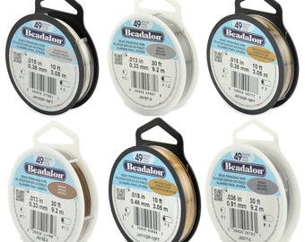 May include: Six spools of Beadalon bead stringing wire in various colors and gauges. The spools are labeled with the wire's diameter in inches and millimeters, as well as the length in feet and meters.