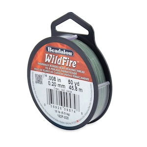 May include: A spool of green Beadalon WildFire thermally bonded bead weaving thread. The spool is labeled with the text "0.008 in 50 yd 0.20 mm 45.8 m Green, Vert, Verde 12 lb (5.5 kg) 162P-008".